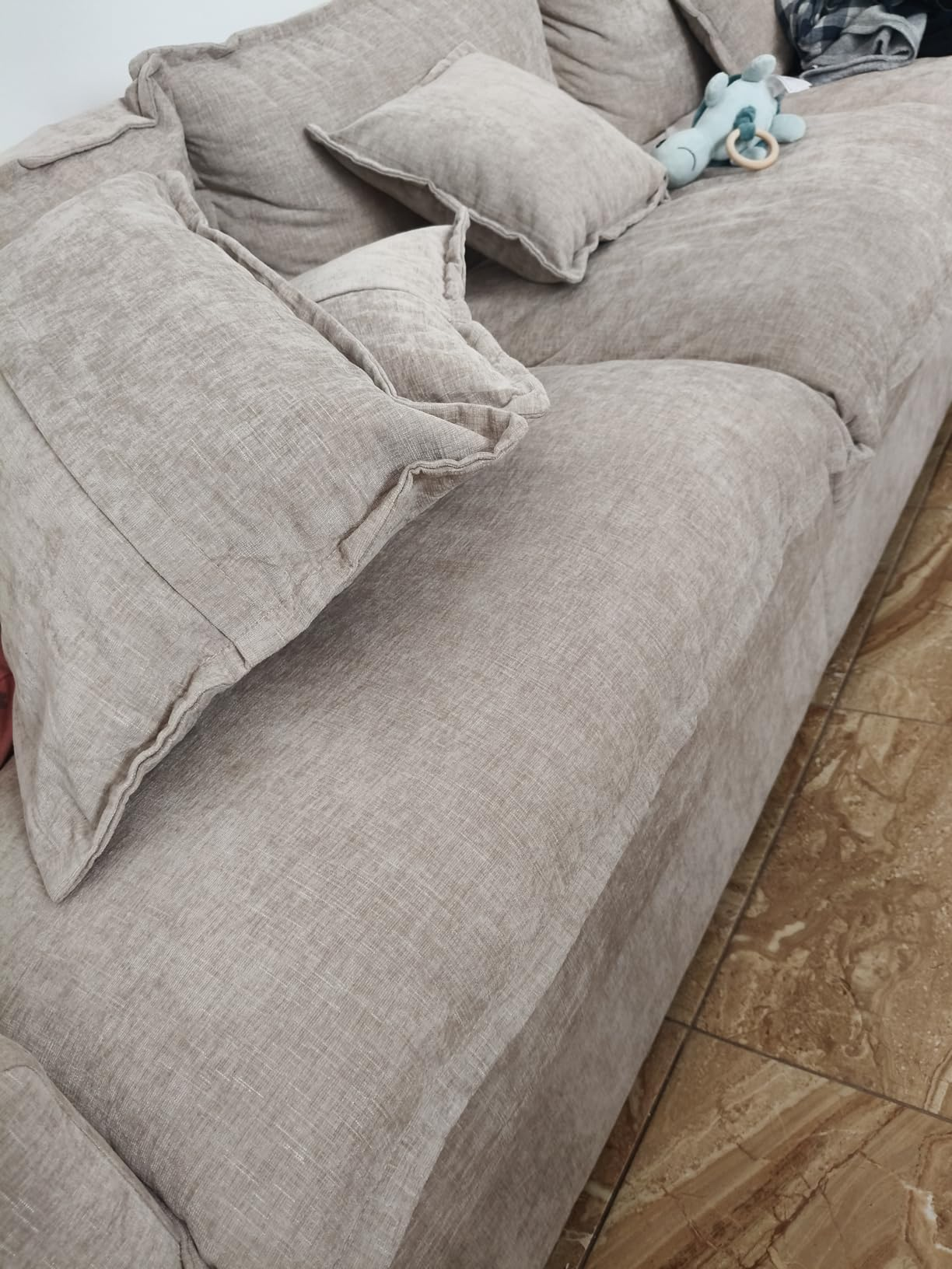 Customer photo of the sofa in a wood-floored room